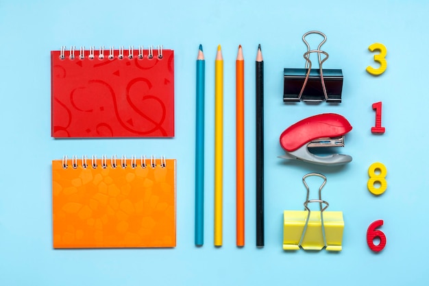 Frame from school and office supplies isolated on blue background Back to school education concept