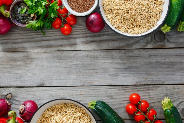 Frame green buckwheat vegetables cooking raw food top view. healthy food