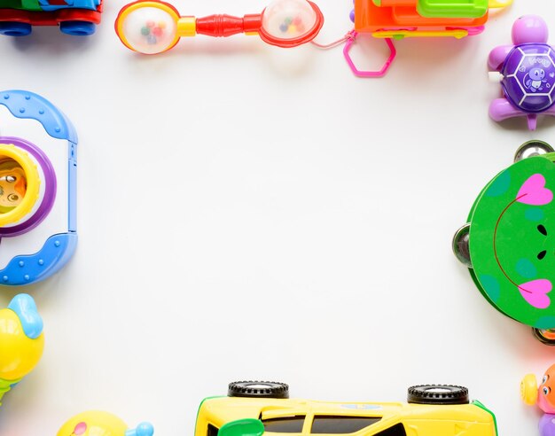 Photo frame made of toy accessories for children on white background top view copy space