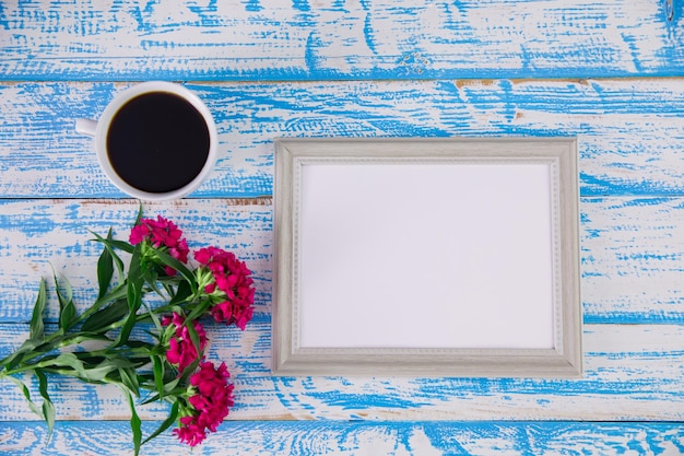 Frame photo with flowers and coffee