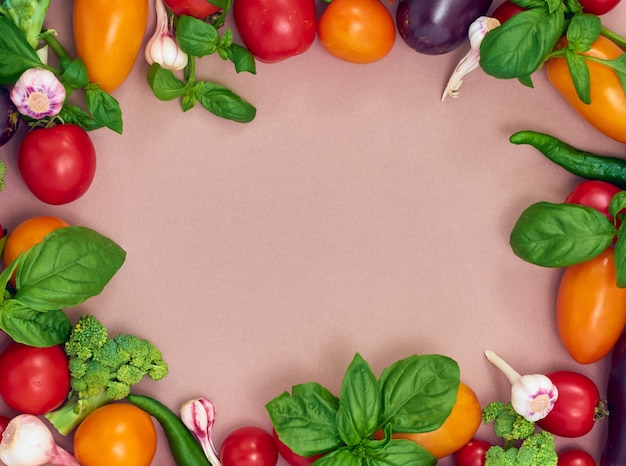 Frame of various  vegetables on wall, top view. Frame of organic food with space for text.