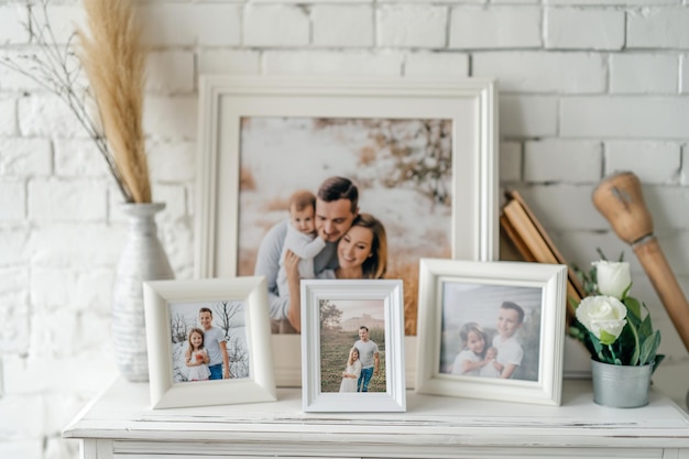 Photo framed family photos on a white wooden table indoors cozying up with family framed photos