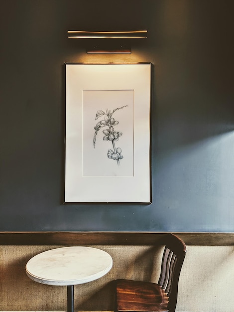 A framed picture of orchids on a wall