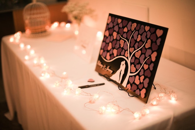 A framed picture of a tree with a heart on it.