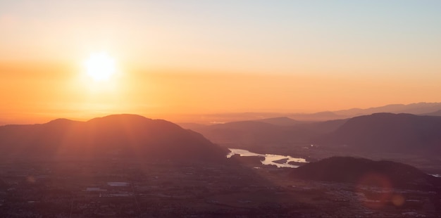 Fraser Valley River and Canadian Mountain Landscape during sunset