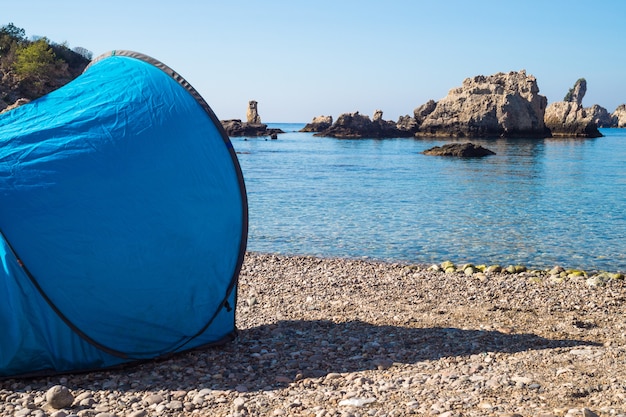 Free camping with a tent at beautiful island in Taormina