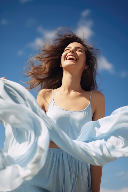 Free laughing young woman against the blue sky