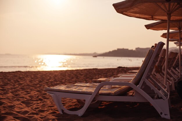 Free sun loungers and sunbeds on the beach. bright soft photo