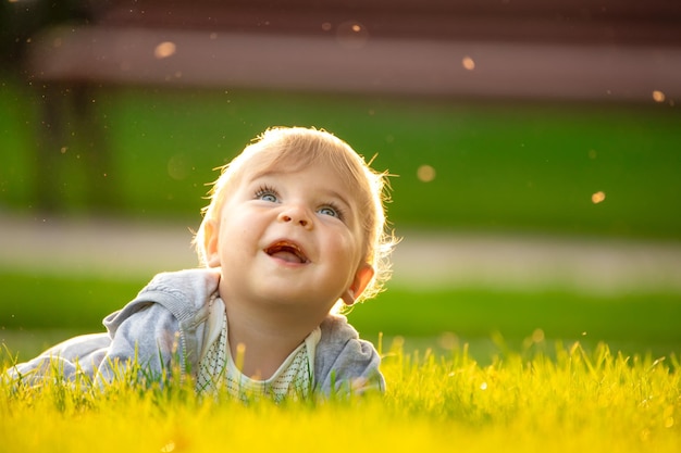 Freedom recreation and childhood concept Happy child outdoors enjoying warm summer day on green lawn in cottage yard