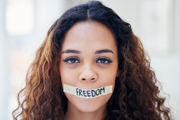 Freedom silence and portrait of woman with tape on mouth voice and fight for equality in human rights Change censorship and girl in protest for sexual harassment domestic violence and revolution