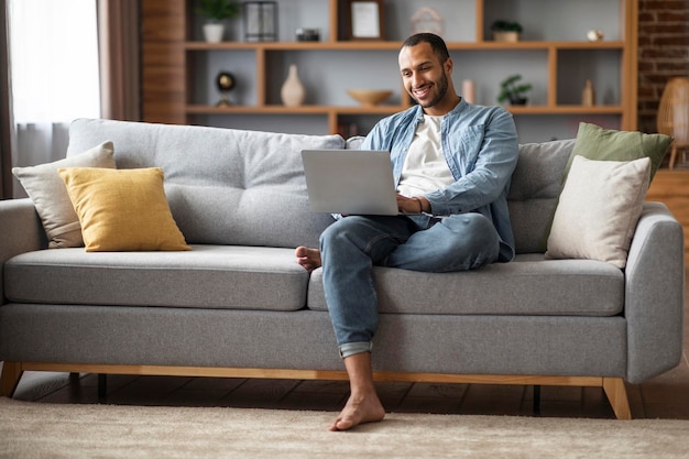 Freelance Concept Happy Young African American Man Using Laptop At Home