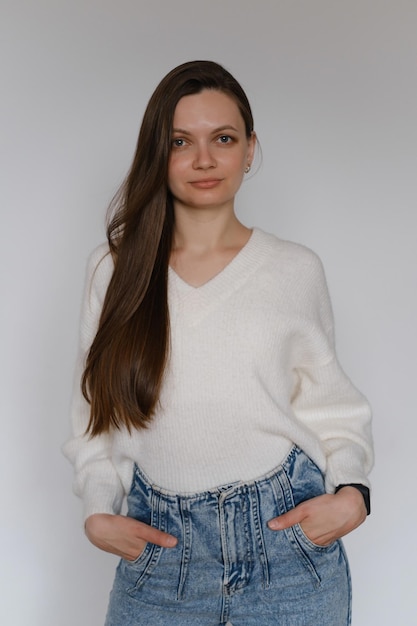 Freelancer business portrait woman in her s over white wall