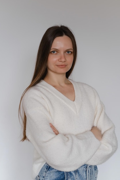 Freelancer business portrait woman in her s over white wall