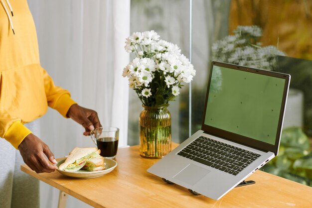 Freelancer Putting Plate on Desk