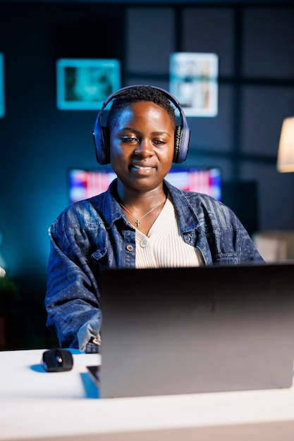 Freelancer using laptop and headphones