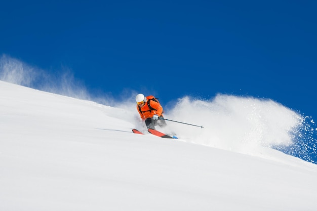 Freerider skier alone in powder snow