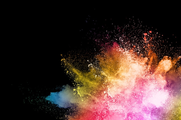 Freeze motion of color powder exploding/throwing color powder, multicolored glitter texture.