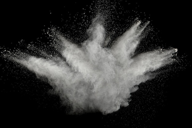 Freeze motion explosion of white powder on  black background.