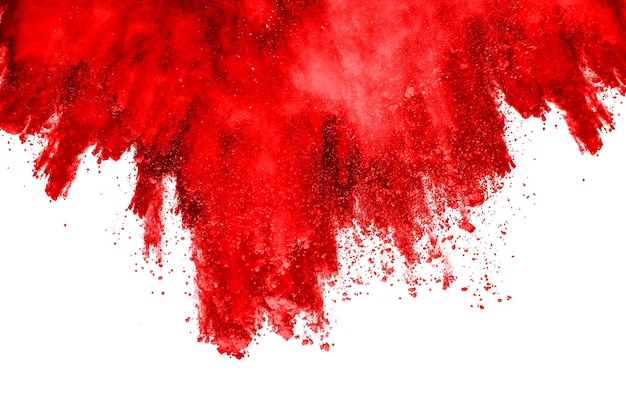 Freeze motion of red powder exploding isolated on white background