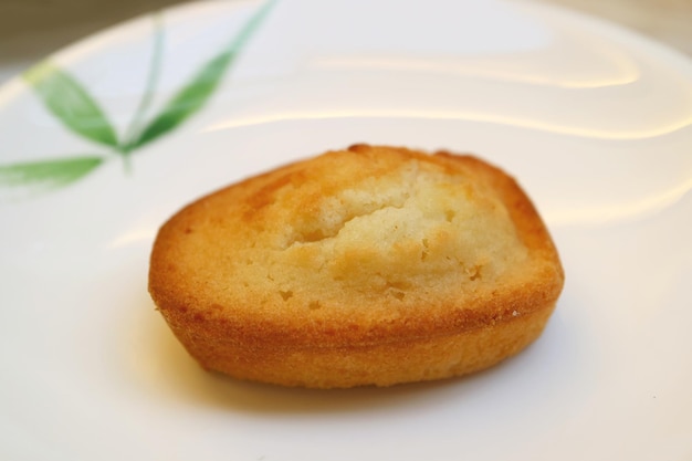 French Almond Petit Four Cake Called Financier Served on White Plate