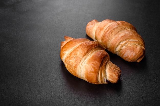 French croissant isolated on black