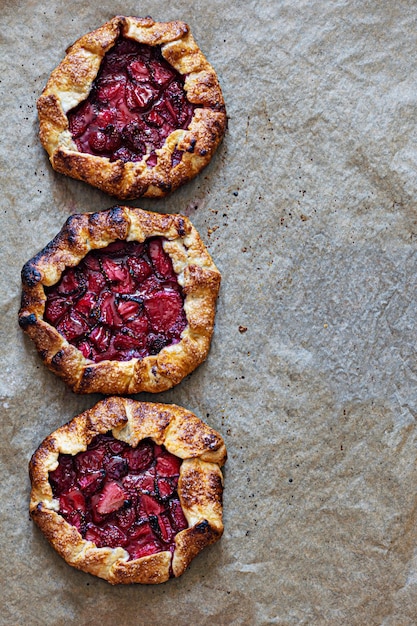 French dessert Galette with shortbread and strawberries Open pie with berries