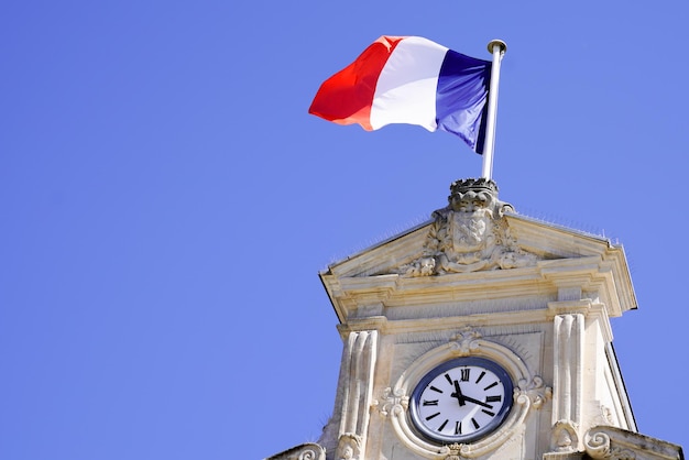 French flag on city hall in city center in france