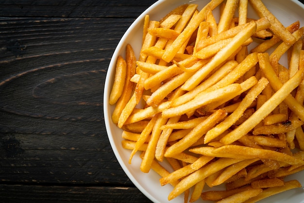 French fries or potato chips with sour cream and ketchup