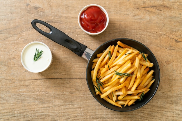 French fries or potato chips with sour cream and ketchup