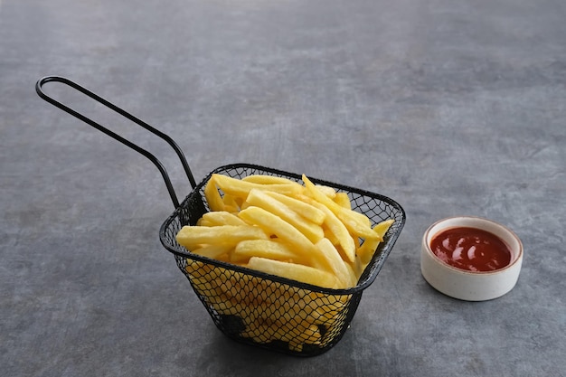 French Fries tasty and savory fast food served with chili sauce Space for text