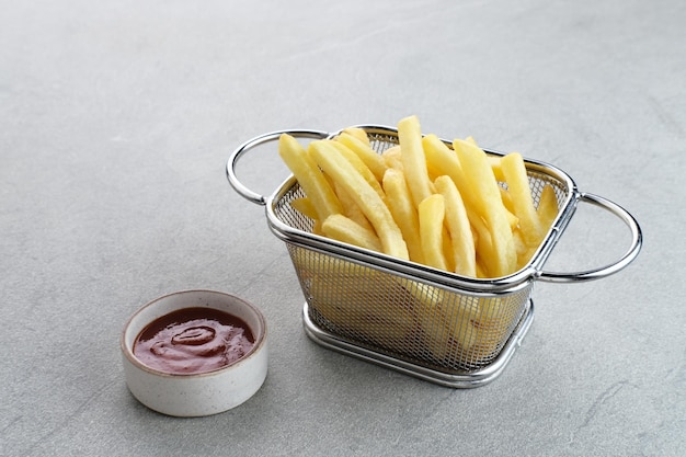 French Fries tasty and savory fast food served with chili sauce Space for text