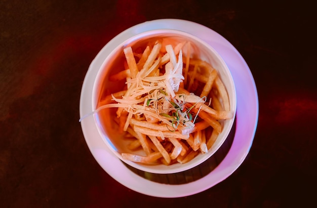 French fries with ketchup on wooden background