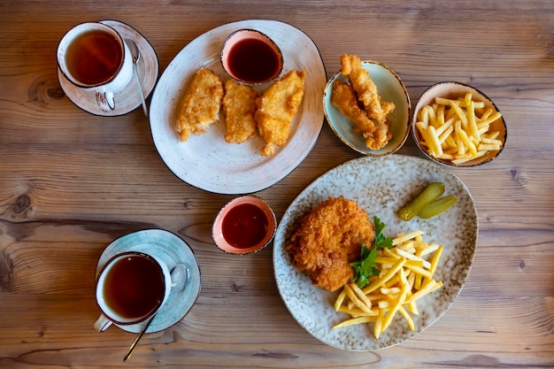 French fries with ketchup on wooden background