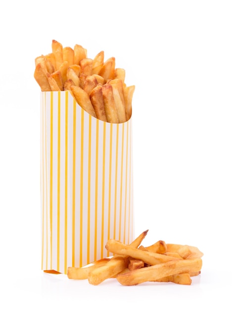 French fries in a yellow paper bag isolated on a white background