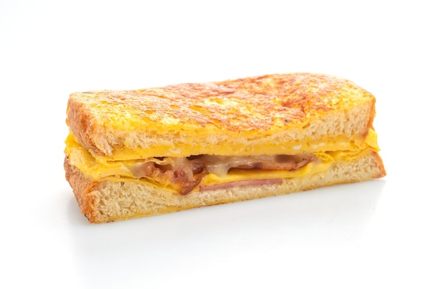 French toast ham bacon cheese sandwich with egg isolated on white background