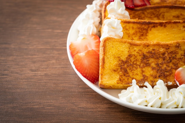 French toast with fresh strawberry and whipping cream