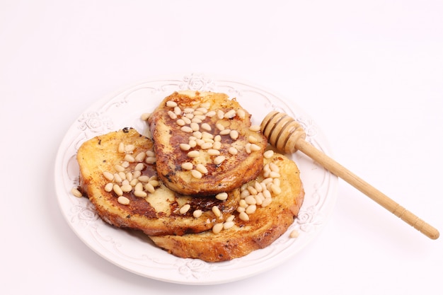 French toast with honey syrup croutons pine nuts breakfast sweet dessert selective soft focus