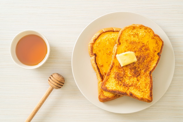 French toasted with butter and honey for breakfast