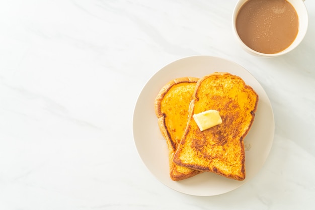 French toasted with butter and honey for breakfast