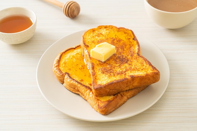 French toasted with butter and honey for breakfast