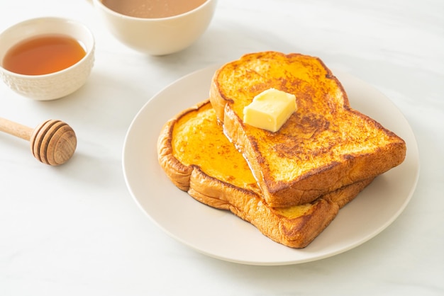 French toasted with butter and honey for breakfast