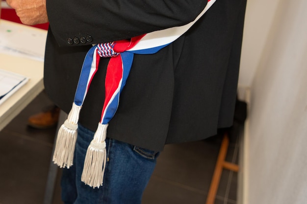 French town mayor man with tricolor scarf during official celebration