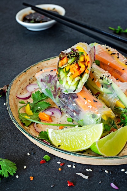 Fresh Asian appetizer Spring rolls (Nem) made from rice paper and raw vegetables. Vietnamese Food