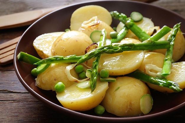 Fresh asparagus with potatoes on plate