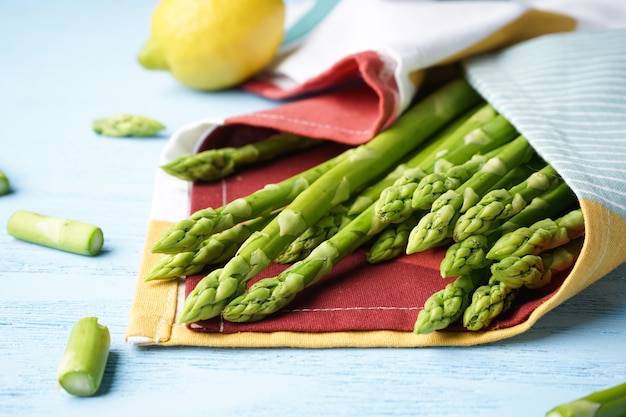 Fresh asparagus on wooden surface. Close-up.