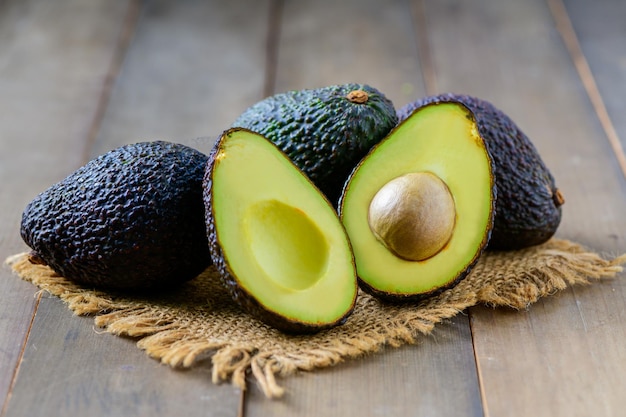 Fresh avocado on wood background High in vitamins and minerals