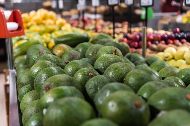 Fresh avocados in the supermarket Vegetables and fruits exposed for the consumer to choose