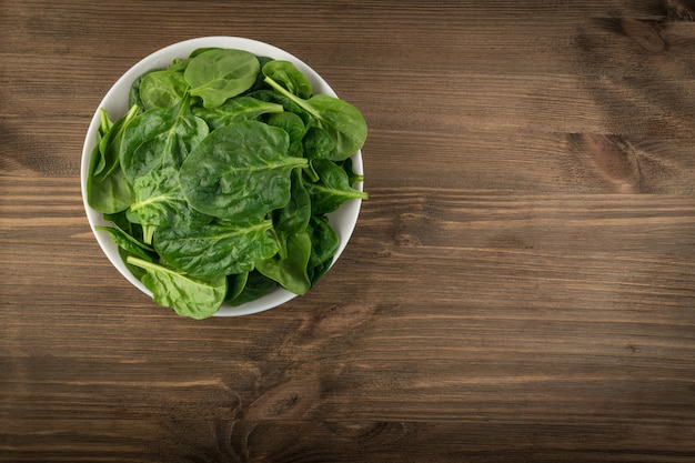 Fresh baby spinach leaves in a bowl