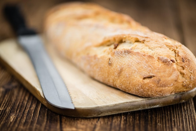 Fresh baked Baguette on wooden background selective focus