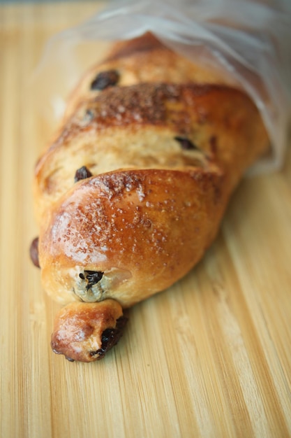 Fresh baked brown sugar pillow raisin on table